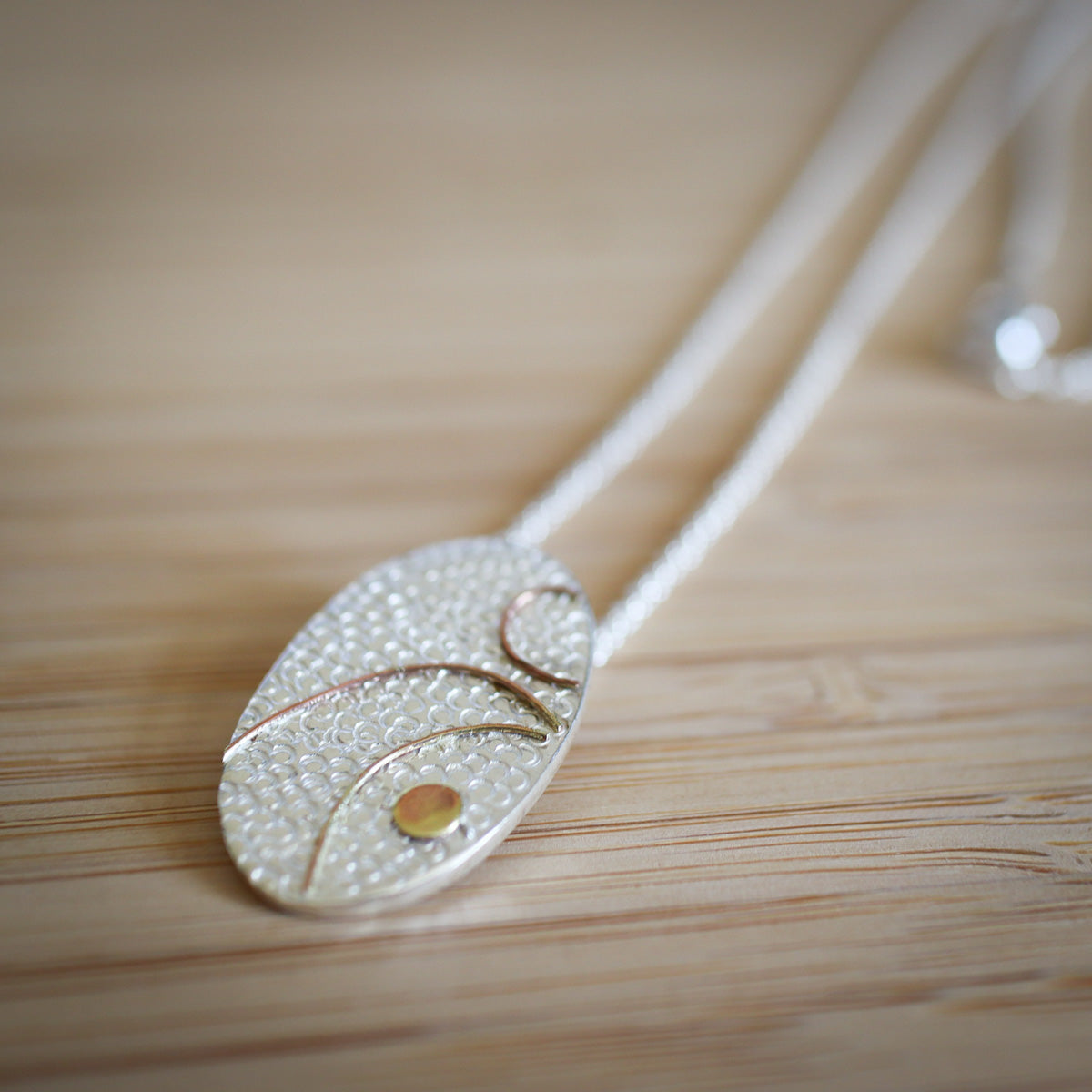 Gilded Oval Pendant
