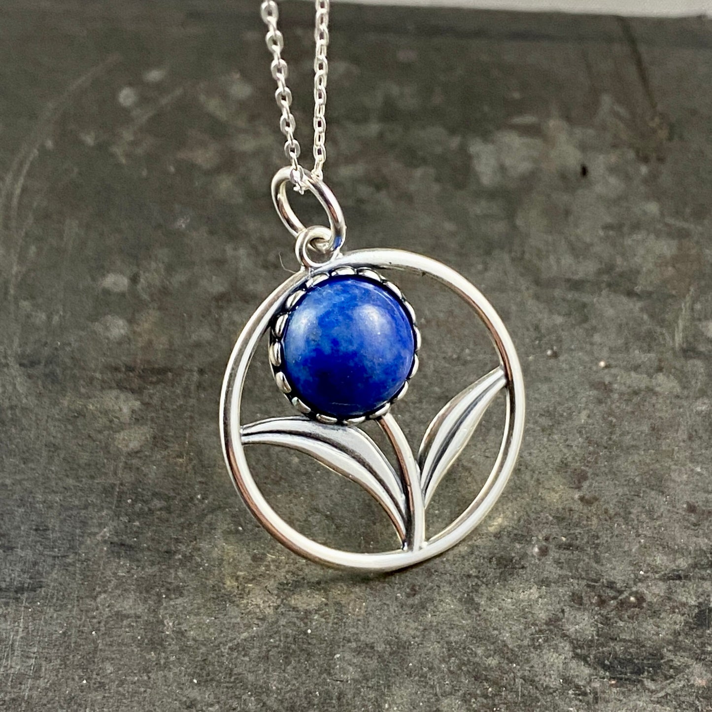 Sterling silver flower pendant with lapis lazuli stone